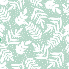 Wall Mural - pastel doodle seamless pattern of hand drawn branch silhouette with leaves on dotted background desi