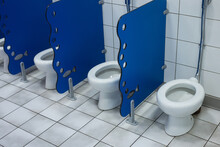 Closeup Of Little Toilets For Kids In A School Lavatory