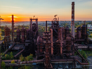 Blast furnace equipment of the metallurgical plant at the sunset, aerial view