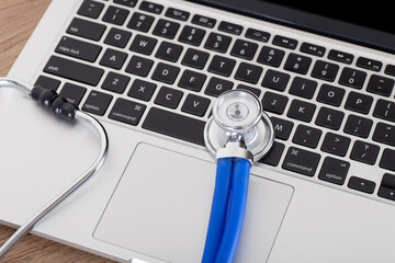 Wall Mural - A stethoscope on a laptop keyboard