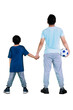 © Creativa Images - Father holds ball and hands of his son on studio