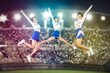 © Creativa Images - Group of beautiful cheerleaders jumping in stadium