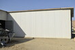 a sandwich panel of insulation on the wall. Construction of a new industrial building. Industrial warehouse construction and outdoor view of the roof ceiling structure. Muscat, Oman