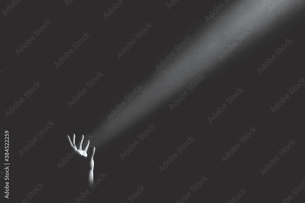 hand holding light ray in the darkness, hope concept - obrazy, fototapety, plakaty 