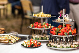 Fototapeta Kuchnia - A set of canapes and snack at a banquet with white table