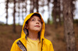 © kegfire - Boy in raincoat exploring autumn forest