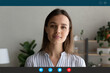 © fizkes - Close up headshot screen view of confident Caucasian businesswoman have webcam conference or online web meeting with client. Young woman speak talk on video call, engaged in virtual event at home.