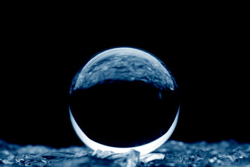 Wall Mural - Abstract glass ball in blue. A crystal ball with blurry pattern. Glass bal in blur.