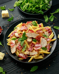 Wall Mural - Chicken, bacon Penne pasta with parmesan cheese and basil. healthy food.