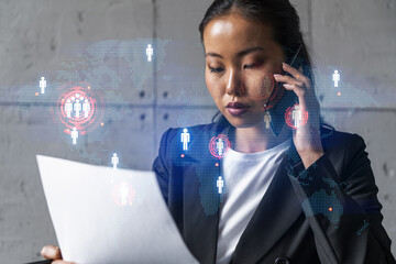 Businesswoman speaks phone and world map hologram. Double exposure.