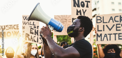 Plakat Activist movement protesting against racism and fighting for equality - Demonstrators from different cultures and race protest on street for equal rights - Black lives matter protests city concept