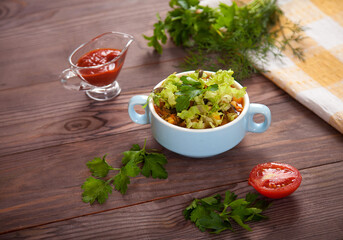 Wall Mural - Bean soup, tomatoes, beans, parsley on a wooden table.Flat lay.