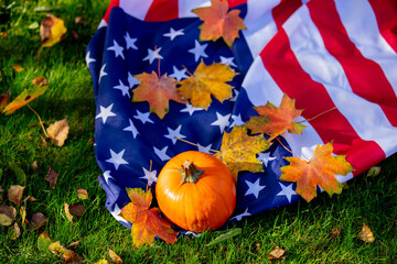 Wall Mural - Little pumpkin and maple leaves with USA flag