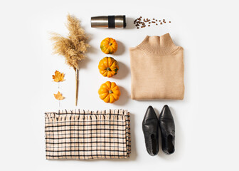 Wall Mural - Fashion flat lay knolling with autumn and winter clothes - beige cozy sweater, plaid scarf, coffee and accessories