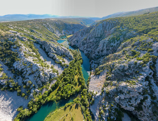 Sticker - Zrmanja River in northern Dalmatia, Croatia is famous for its crystal clear waters and countless waterfalls surrounded by a deep canyon.