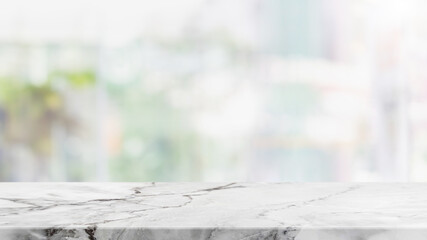 Empty white marble stone table top and blur glass window interior cafe and restaurant banner mock up abstract background - can used for display or montage your products.