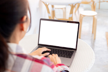 Wall Mural - computer mockup blank screen.hand woman work using laptop with white background for advertising,contact business search information on desk at coffee shop.marketing and creative design