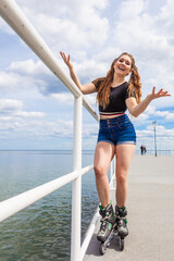 Sticker - Joyful teen girl wearing roller skates