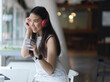 © bongkarn - Female relaxing with headphone and coffee cup in co working space