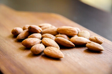 Almonds on a wooden cutting board