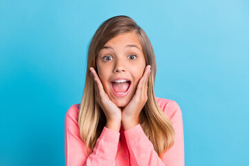 Sticker - Photo portrait of screaming girl touching face cheeks with two hands isolated on pastel blue colored background