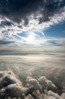 Dramatic sky panorama with sun between clouds. Majestic cloud scenery, taken while ballooning