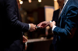 Fototapeta Londyn - Exchange Of Business Cards at a Networking Event