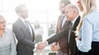 © yurolaitsalbert - business partners shaking hands before starting negotiations.