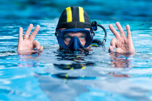 Scuba Diver Makes The Ok Sign With Two Hands