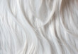Platinum blond hair close up. White hair background or texture.