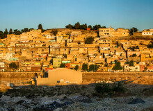 City Town Buildings With Old Facade And Tumbledown Neighborhood In Middle East With Yellow Sunset