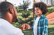 © Afshar Tetyana - Cheerful child smiling and fist-bumping his father