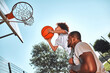 © Afshar Tetyana - Afro-American kid playing basketball with his father