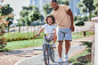 © Afshar Tetyana - Cute curly kid learning how to ride a bike