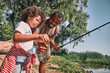 © Afshar Tetyana - Cute Afro-American child holding a fish he just caught