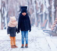 Cute Kids, Brothers Walking Together In Winter Park