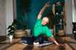 © ulza - senior man  doing stretching exercise and yoga at home.  home fitness, activewear. Healthy and sport lifestyle.