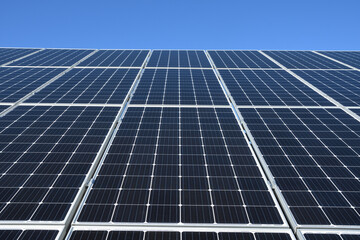 Wall Mural - Solar panels against blue sky background.Against The Deep Blue Sky in suny weather