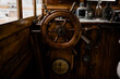 © Isaiah & Taylor Photography/Stocksy - Boat steering wheel