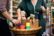 © VegterFoto/Stocksy - Toy Shop Owner Looking At Items Brought In By Customer