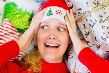 A Woman Worried And Stressed Out During The Holiday Season. Christmas Gift Shopping.