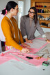 © Katarina Radovic/Stocksy - Fashion Designer Working in Their Studio