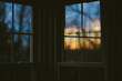 © Lauren Lee/Stocksy - Sunset seen through window