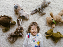 Little Girl With Stuffed Animals