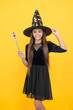 © be free - happy witch teenage girl with magic wand wear costume of wizard on halloween party, halloween
