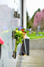 Flowers In A Vase On The Mausoleum Wall