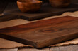Empty Wooden chopping board over a wood table