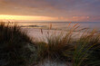 Jesienny zachód słońca na wybrzeżu Morza Bałtyckiego, wydmy, plaża,Dźwirzyno,Polska.