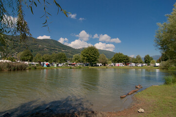 Wall Mural - View of the gulf of Agno and a campsite in Switzerland