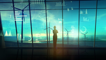 Wall Mural - business woman in a dark room in front of a virtual data array and wind farms.